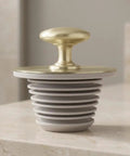 GLSTOY Bathtub Drain Stopper Rubber Plug with Handle Stepped Seal, gray and gold design, ideal for various drain sizes.
