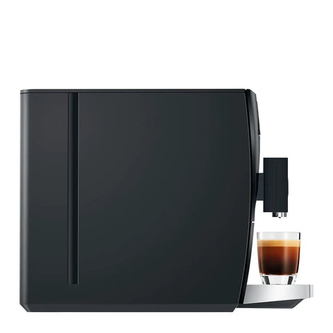 Top Shelf Automatic Coffee Machine In Sleek Piano Black featuring freshly brewed espresso in a glass cup on the counter.