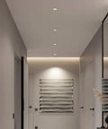 MXJCKSOQ 2 Pack LED Recessed Retrofit Downlight,7W, 12W, 18W LED Ceiling Light installed in a modern hallway.