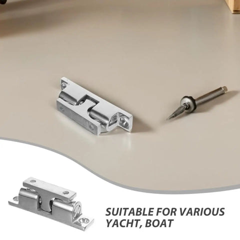 Sleek Stainless Steel Door Catch for Yacht Cabin Doors resting on a surface, displaying heavy-duty marine grade hardware.