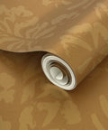 Rustic Floral Pink Gold Metallic Wallpaper With Fibrous Texture Pvc Free Wall Covering rolled and partially unwrapped.