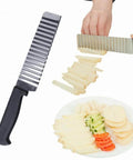 Two-piece stainless steel potato slicer set with crinkle and straight blades; black-handle cutter and plate of sliced potatoes.