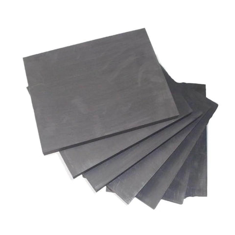 Stack of graphite blocks, 100x100x8 mm, self lubricating sheet for easy machining and durable performance in 3D printing applications.