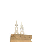 Plastic White Square Clock Hands With 1-3/8 Inch Minute Hole And Center Axis A-13 Replacement Parts against ruler for size comparison