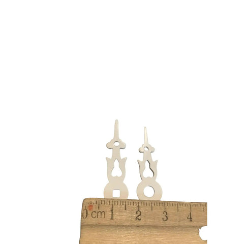 Plastic White Square Clock Hands With 1-3/8 Inch Minute Hole And Center Axis A-13 Replacement Parts against ruler for size comparison