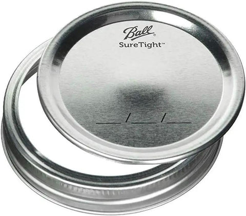 Ball SureTight metal lid for wide mouth glass mason jars, ideal for canning and preserving, ensuring airtight seals.