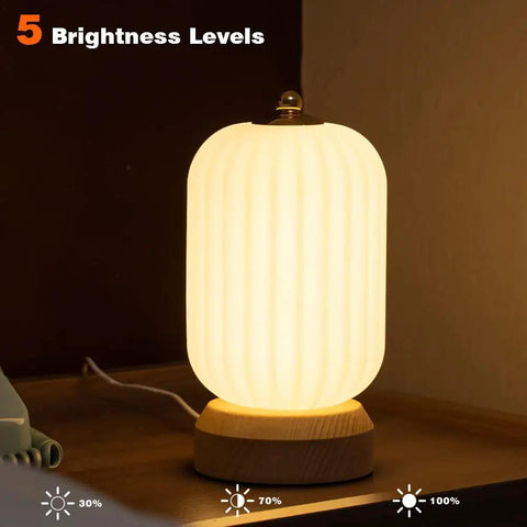 Cozy Small Table Lamp For Bedroom And Nightstand, Kid Friendly Minimalist Solid Wood Desk Lamp shown with five brightness levels