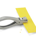 Heavy Duty One Eighth Inch Circle Craft Punch For Cardstock Chipboard And Lightweight Metal With Locking Handle in use on yellow sheet