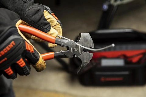 Close-up of Heavy Duty Solid Joint Fence Tool Pliers, 10 Inch, Ergonomic Dipped Handle, Pro Grade Hand Tool in use by a person wearing gloves