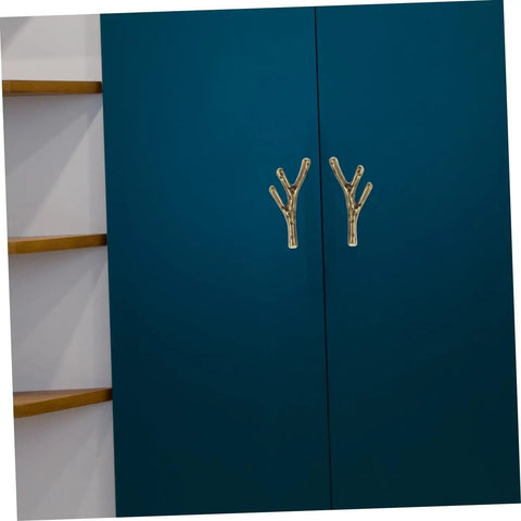 Gold branch-style cabinet knobs on blue wardrobe doors, part of Branch Shape Cabinet Knobs 4 Piece Set for Cabinets and Drawers Dressers Cupboards and Closets Easy Open Vintage Style Furniture Handles Decorative Hardware for Kitchen and Home Renovations.