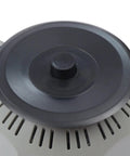 Close-up of carousel round tape dispenser on automatic ribbon cutting machine with adjustable 6 to 60 mm cutting length and 3 to 25 mm tape width.