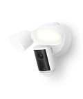 Floodlight Cam Pro Wired Security Camera With Retinal 4K Video Wide Angle View 10x Enhanced Zoom 2000 Lumen Floodlights Live View And Two Way Talk Ideal For Home Or Small Biz Security White mounted on wall.