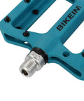 Ultralight Non Slip Nylon Fiber Mountain Bike Pedals Flat Platform Nine Sixteenth Inch Spindle For MTB BMX And Road Cycling Grippy Durable Pedals In Blue, close-up of spindle
