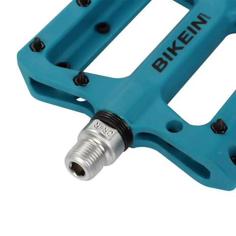Ultralight Non Slip Nylon Fiber Mountain Bike Pedals Flat Platform Nine Sixteenth Inch Spindle For MTB BMX And Road Cycling Grippy Durable Pedals In Blue, close-up of spindle