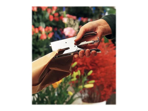 Classic K1 Plier Stapler, Chrome, Built To Last With 50 Sheet Capacity And Back Loading, Adjustable Anvil, in use wrapping florists paper