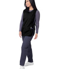 Model wearing Unisex Cobbler Aprons 3 Pack Black Durable Work Apron With Deep Front Pockets Self Trim Binding Classic Fit 27.5 Inches Long