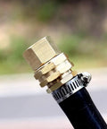 Beefy 3/4 FHT to 1/2 MIP Brass Hose Adapter shown connected to a garden hose, showcasing the leak-free connection and solid brass build.