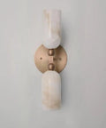 Alabaster Wall Sconce Lighting, Brass Wall Light Fixture with Natural Stone Shade, Double Cylinder Up Down Wall Lamp highlighted against a wall.