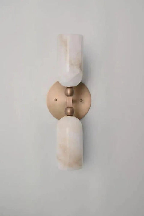 Alabaster Wall Sconce Lighting, Brass Wall Light Fixture with Natural Stone Shade, Double Cylinder Up Down Wall Lamp highlighted against a wall.