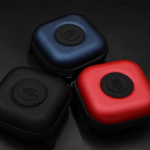 Built Tough Black Earphone Case With A Smooth Glide Zipper Secure Storage Bag For Iem Earphones In Ear Headset And True Wireless Earbuds Reliable Everyday Carry Pouch in black, red, and blue colors on a dark surface.