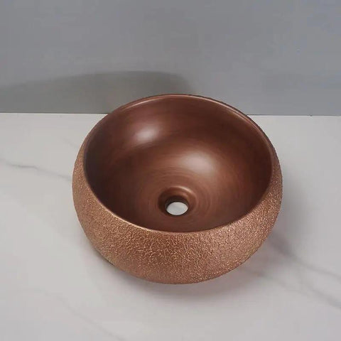 USZWBY Vessel Sinks Bathroom Sink European Round Rose Gold Home Hotel Above Counter Basin Ceramic Wash Bathroom Bowl Sink on gray countertop.