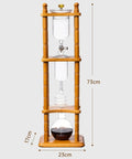 720 Milliliter Cold Brew Coffee Tower With Adjustable Valve Makes Five To Seven Cups featured with wooden stand and glass components.