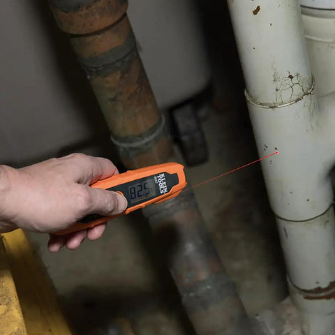 Person using IR07 Dual Infrared And Probe Pocket Size LCD Digital Thermometer With 8 To 1 Distance To Spot Wide Minus 40F To 752F Range Handy On The Go Temp Meter For Quick Accurate Readings In Cooking HVAC Automotive And More on pipes
