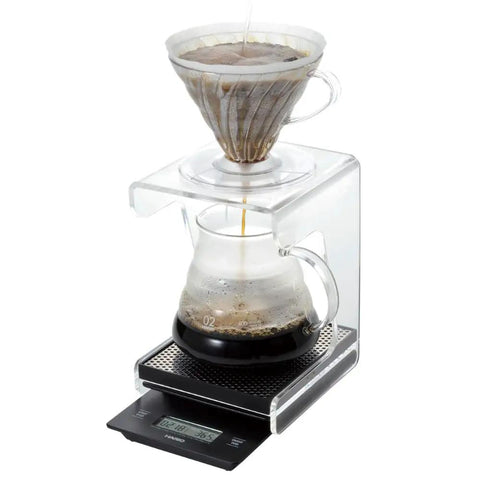 V60 Drip Scale Black For Precision Pour Overs With Zero Point One Gram Increments shown with glass dripper and carafe