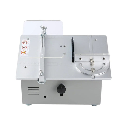 Ultra Compact Mini Electric Table Saw With Slick Angle Guide And Quick Lift Blade For Clean Wood Cuts Portable Workbench Tool DC Powered No Sweat Setup Killer Precision Cuts top view showing metal body and adjustable guide.