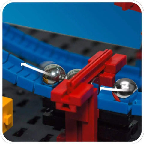 Advanced Funny Machines Construction Kit With 585 Parts For Building 3 Dope Models Like Marble Run And Cable Car Courses Trigger Domino Effects Launch A Catapult And Easily Integrate Dominoes Or Other Toys For Endless STEM Fun. Close-up of marble run track with steel balls and red launcher.