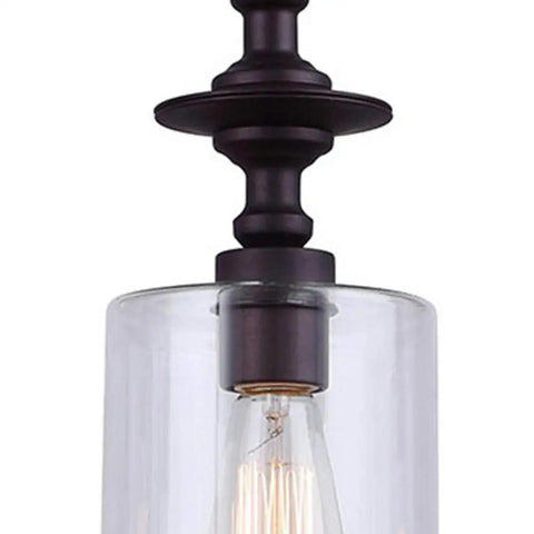 Close-up of Oil Rubbed Bronze Pendant Light With Clear Glass, 3 Light Cord Pendant, Uses 100W Type A Bulbs, Adjustable Height