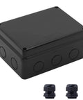 Front-right angle view of outdoor IP65 waterproof electrical box in black ABS plastic, 5.9x4.3x2.8 in, with two cable glands