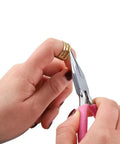 Hands using pliers on a gold-tone jump ring from Over 1050 Pcs Open Jump Rings Set In Gold Tone, 304 Stainless Steel, Six Size Range From 4mm To 10mm.