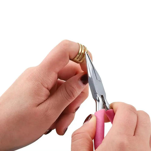 Hands using pliers on a gold-tone jump ring from Over 1050 Pcs Open Jump Rings Set In Gold Tone, 304 Stainless Steel, Six Size Range From 4mm To 10mm.
