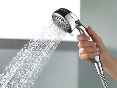 Hand holding 7 Spray Touch Clean Handheld Shower Head With Hose Chrome Finish Easy Clean Nozzles Powerful Full Body Spray Settings