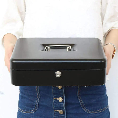 Person holding locking cash box with money tray and security cable, heavy duty metal safe for tips and cash, key lock visible