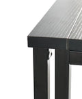 Close-up of the Rock Solid Collapsible Gaming Desk's black particleboard edge and sturdy foldable mechanism.