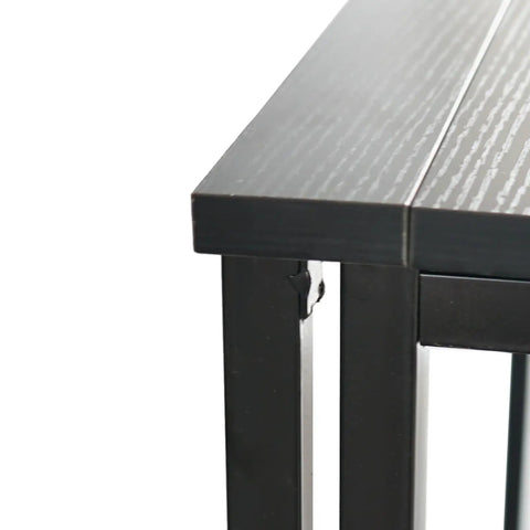 Close-up of the Rock Solid Collapsible Gaming Desk's black particleboard edge and sturdy foldable mechanism.
