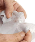 Close-up of hands holding Disposable Lab Coats For Adults With Pockets White Lab Jackets With Knitted Cuffs And Collar Pack Of 10 Large