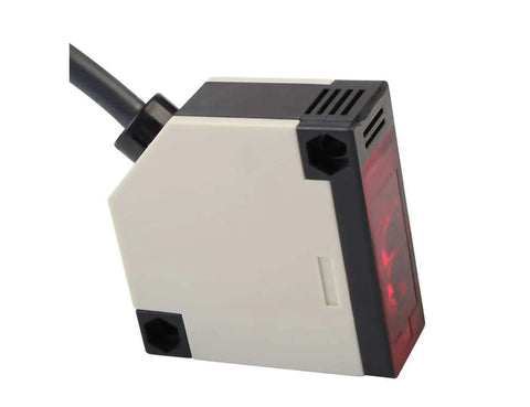Close-up of Invisible Retro Reflective Photoelectric Beam Sensor for garage doors and gates, featuring high-tech design and 6-ft cable.