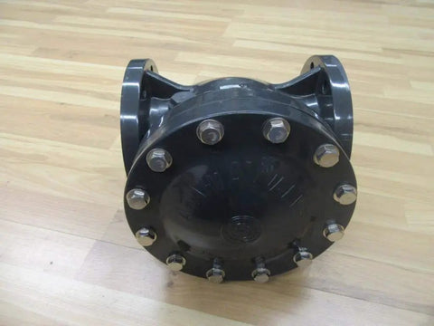 Rock Solid 4 Inch Swing Check Valve Hi PVC Body, heavy-duty black valve with bolts for plumbing systems.