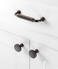 Give Your Cabinets A Serious Glow Up With These Heavy Duty 3 Inch Pulls In Smooth Oil Rubbed Bronze on white cabinets.