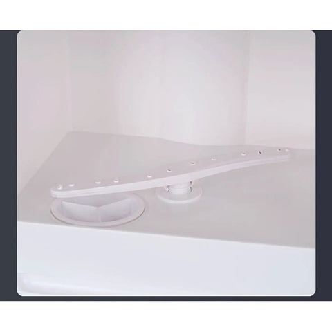 Plug And Go Compact Desktop Dishwasher With Intelligent Drying And Triple Wash Filter designed interior component with spray arm and filter.