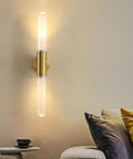 Wall Sconce Lights Indoor Bedroom Hallway GU10 2- Modern Long Brushed Middle Ages Brass Linear Clear Glass Copper Mount Lamp for Bedside Study Children's Room Bathroom mounted beside a cozy sofa.