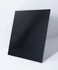 Black Phenolic Sheets Pack Of Three 12x12 Inch Panels 1/8 Inch Thick Laminated Resin Plate Board shown standing upright