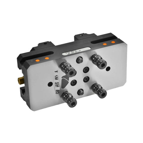 Dead Nuts Precise Self Centering Vise For Five Axis Cnc Machines with a steel body and multiple clamping ports.