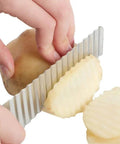 Fyigoto 2-pack stainless steel crinkle-cut potato slicer knife in close-up slicing potatoes into wavy fries