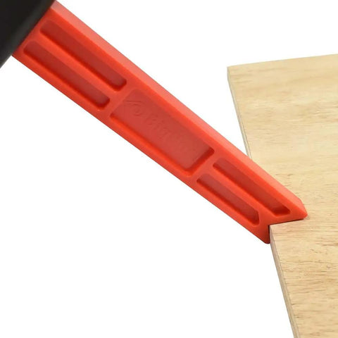 Plastic Magnetic Push Stick with Ergonomic Black Handle and Red Shaft demonstrating usage on wood