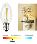 Cozy C7 LED Night Light Bulbs With E12 Candelabra Base, Clear Warm White 2700K, shown in socket with light spectrum chart