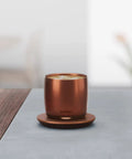 Renewed 6 Oz Smart Heated Coffee Mug With App Precision Temp Control And Solid Battery Life Keeps Your Favorite Brew Piping Hot And Ready For All Day Sipping Sessions on a table.